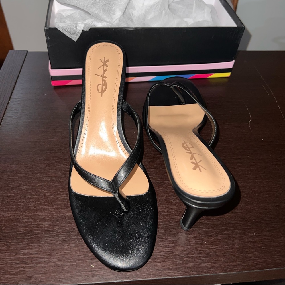 Size 11 Black Heel Thong Sandals. Brand new never worn in original box